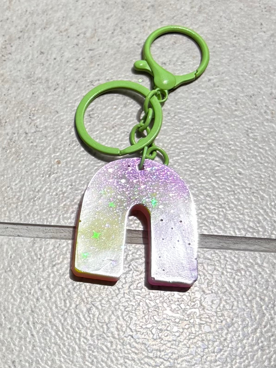 purple and green keychain