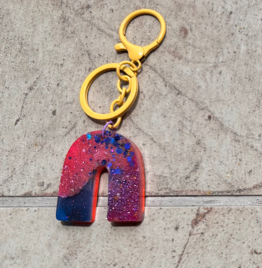 pink, blue and yellow keychain
